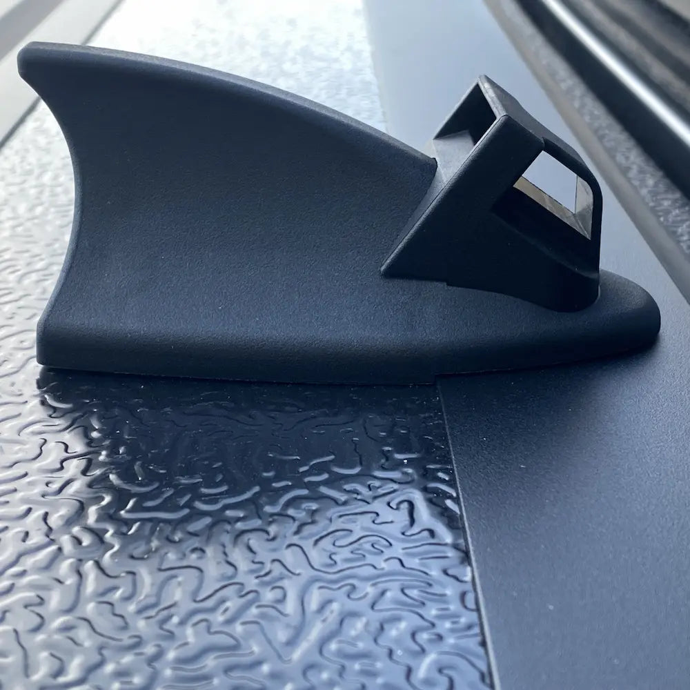 Teamz hard tri-fold tonneau cover using stoppers on first panel to protect truck cab and back window